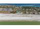 Aerial view of beachfront community and tennis courts at 6750 Gulf Of Mexico Dr # 153, Longboat Key, FL 34228