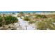 Steps to the beach from your home at 6750 Gulf Of Mexico Dr # 153, Longboat Key, FL 34228