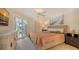 Bright bedroom with a king-size bed and private balcony access at 6750 Gulf Of Mexico Dr # 153, Longboat Key, FL 34228