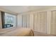 Bedroom with a queen-size bed and ample closet space at 6750 Gulf Of Mexico Dr # 153, Longboat Key, FL 34228