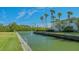 Private canal access with lush landscaping at 6750 Gulf Of Mexico Dr # 153, Longboat Key, FL 34228