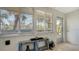 Bright condo entryway with a view, showcasing natural light and tiled floors at 6750 Gulf Of Mexico Dr # 153, Longboat Key, FL 34228