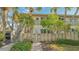 Condo exterior featuring a private entrance, stairs, and landscaped surroundings at 6750 Gulf Of Mexico Dr # 153, Longboat Key, FL 34228