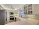 Modern kitchen with stainless steel appliances and white cabinets at 6750 Gulf Of Mexico Dr # 153, Longboat Key, FL 34228