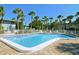 Inviting community pool with ample seating at 6750 Gulf Of Mexico Dr # 153, Longboat Key, FL 34228