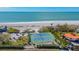 Beachfront property featuring two well-maintained tennis courts at 6750 Gulf Of Mexico Dr # 153, Longboat Key, FL 34228