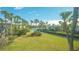 Scenic waterfront view with lush landscaping at 6750 Gulf Of Mexico Dr # 153, Longboat Key, FL 34228