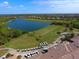 Aerial view of golf course, clubhouse, and community at 6819 Grand Estuary Trl # 102, Bradenton, FL 34212