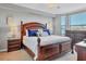 Spacious main bedroom with king-size bed and large windows at 6819 Grand Estuary Trl # 102, Bradenton, FL 34212