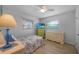 Cozy bedroom with light walls and a blue patterned bedspread at 7510 16Th Nw Ave, Bradenton, FL 34209