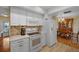 Bright kitchen with white cabinets, stainless steel appliances, and tile backsplash at 7510 16Th Nw Ave, Bradenton, FL 34209