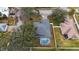 Single story house with pool, aerial view at 7664 39Th Street E Cir, Sarasota, FL 34243