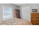 Bedroom with built-in cabinet and window with blinds at 7664 39Th Street E Cir, Sarasota, FL 34243