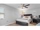 Main bedroom with ceiling fan, and a dresser at 7664 39Th Street E Cir, Sarasota, FL 34243