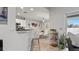 Dining area with glass table and white chairs at 7664 39Th Street E Cir, Sarasota, FL 34243