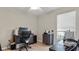 Home office featuring a desk, chair, and printer at 7664 39Th Street E Cir, Sarasota, FL 34243