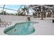 Screened pool area with grill and dolphin statue at 7664 39Th Street E Cir, Sarasota, FL 34243