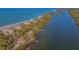 Aerial view showing home's beachfront location and waterway access at 777 N Manasota Key Rd, Englewood, FL 34223