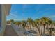 Balcony overlooking the ocean and palm trees at 777 N Manasota Key Rd, Englewood, FL 34223