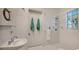 Clean bathroom with shower, sink, and decorative tiles at 777 N Manasota Key Rd, Englewood, FL 34223