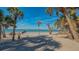 Stunning beachfront view with palm trees and tranquil ocean at 777 N Manasota Key Rd, Englewood, FL 34223