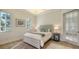 Bright bedroom with a light-toned bed and tiled floors at 777 N Manasota Key Rd, Englewood, FL 34223