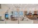 Spacious living room with ocean view and kitchen access at 777 N Manasota Key Rd, Englewood, FL 34223