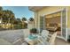 White patio furniture near a private bedroom at 777 N Manasota Key Rd, Englewood, FL 34223