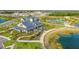 Aerial view of a community with a clubhouse, pool, and lake at 8043 Waterbend Trl, Sarasota, FL 34240