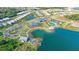 Community overview featuring a lake, clubhouse, and neighborhood at 8043 Waterbend Trl, Sarasota, FL 34240