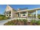 Elegant clubhouse with welcoming exterior and landscaping at 8043 Waterbend Trl, Sarasota, FL 34240