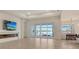 Living area with fireplace and sliding doors to pool at 8043 Waterbend Trl, Sarasota, FL 34240