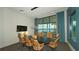 Modern meeting room with a large table and lake views at 8043 Waterbend Trl, Sarasota, FL 34240