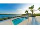 Tranquil spa with a view of the lake and palm trees at 8043 Waterbend Trl, Sarasota, FL 34240