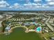 Panoramic aerial view of community amenities with multiple lakes, pools, and recreational facilities at 8261 Grande Shores Dr, Sarasota, FL 34240