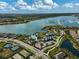 Aerial view of a gorgeous community pool surrounded by lush landscaping and resort-style amenities at 8261 Grande Shores Dr, Sarasota, FL 34240