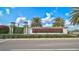 Community entrance sign for LakeHouse Cove at Waterside with palm trees and manicured landscaping at 8261 Grande Shores Dr, Sarasota, FL 34240