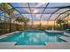 Enclosed pool with beautiful views, perfect for relaxing and enjoying the outdoors at 8261 Grande Shores Dr, Sarasota, FL 34240