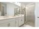 Modern bathroom with double vanity and glass shower at 8612 Evening Dr, Sarasota, FL 34241