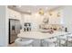 Modern kitchen with white cabinets and a large island at 8612 Evening Dr, Sarasota, FL 34241