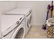 Bright laundry room with Samsung washer and dryer, and ample storage at 8612 Evening Dr, Sarasota, FL 34241