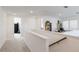 Spacious loft area with built-in shelving and a view to a bedroom at 8612 Evening Dr, Sarasota, FL 34241