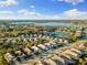 Aerial view showcasing community and lake at 883 Seascape Pl, Sarasota, FL 34240