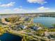 Aerial view of community with lake, pool, and clubhouse at 883 Seascape Pl, Sarasota, FL 34240