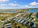 Aerial view of community, showcasing homes and waterways at 883 Seascape Pl, Sarasota, FL 34240