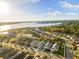 Aerial view of a luxury community with lake access and numerous homes at 883 Seascape Pl, Sarasota, FL 34240