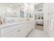 Elegant bathroom with double vanity, large mirror, and a walk-in shower at 883 Seascape Pl, Sarasota, FL 34240