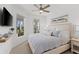 Spacious bedroom with a king-size bed and large windows offering natural light at 883 Seascape Pl, Sarasota, FL 34240