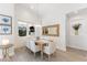 Bright dining room with a rustic wooden table and seating for six at 883 Seascape Pl, Sarasota, FL 34240