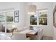 Bright dining area with a farmhouse table and access to the patio at 883 Seascape Pl, Sarasota, FL 34240